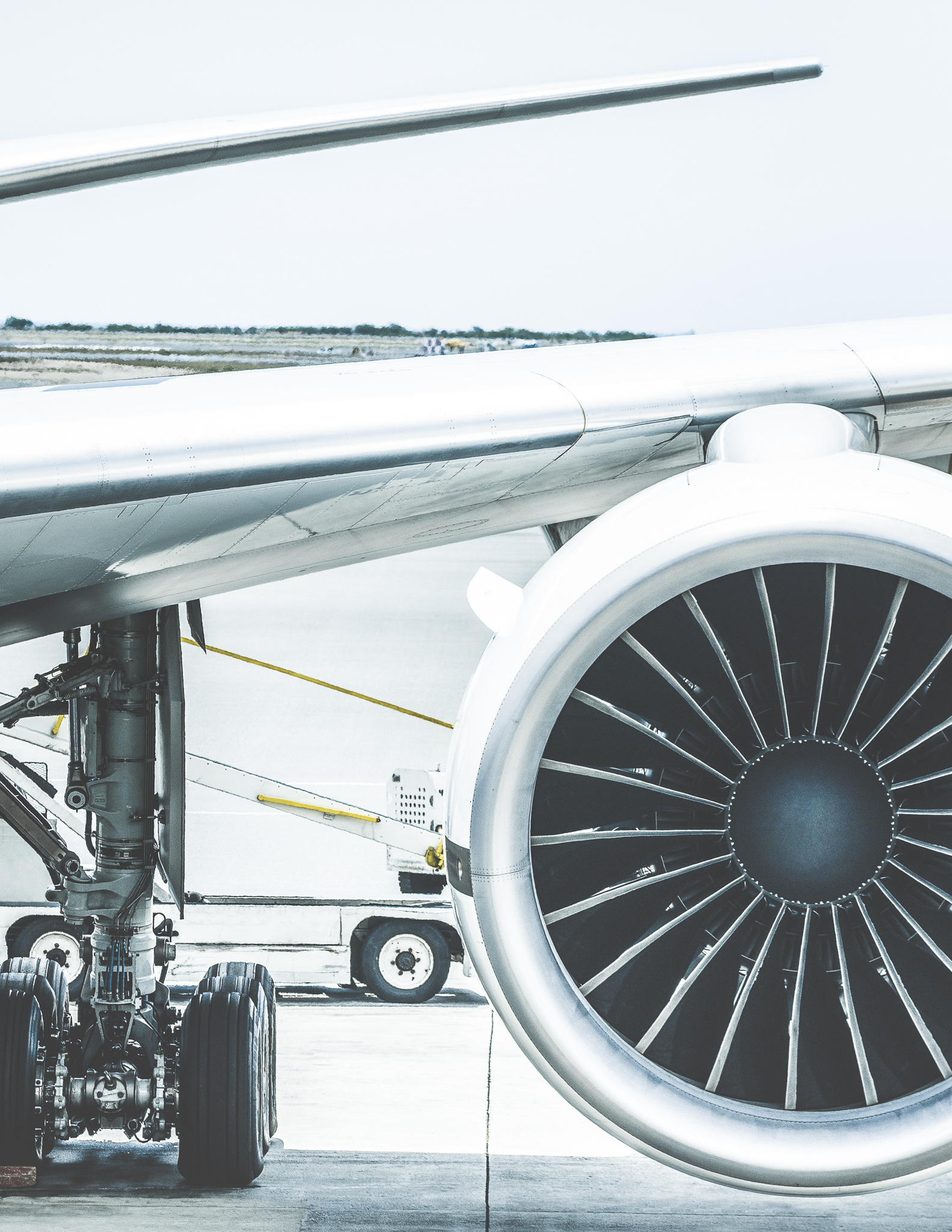 Detail of airplane engine wing at terminal gate before takeoff -